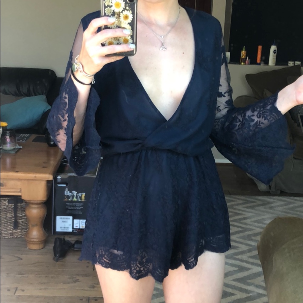 Deep V-neck navy blue lace romper